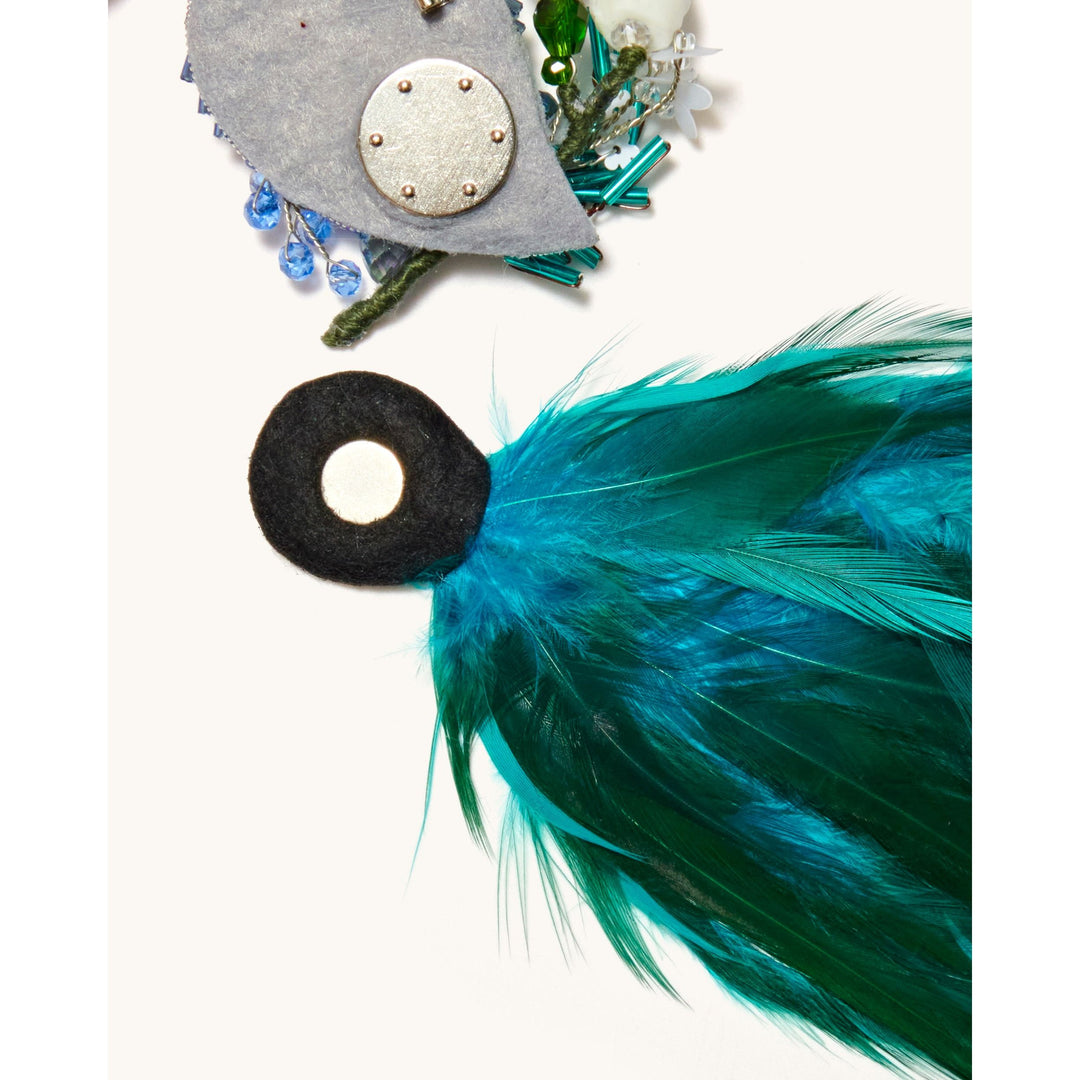 peacock brooch blue